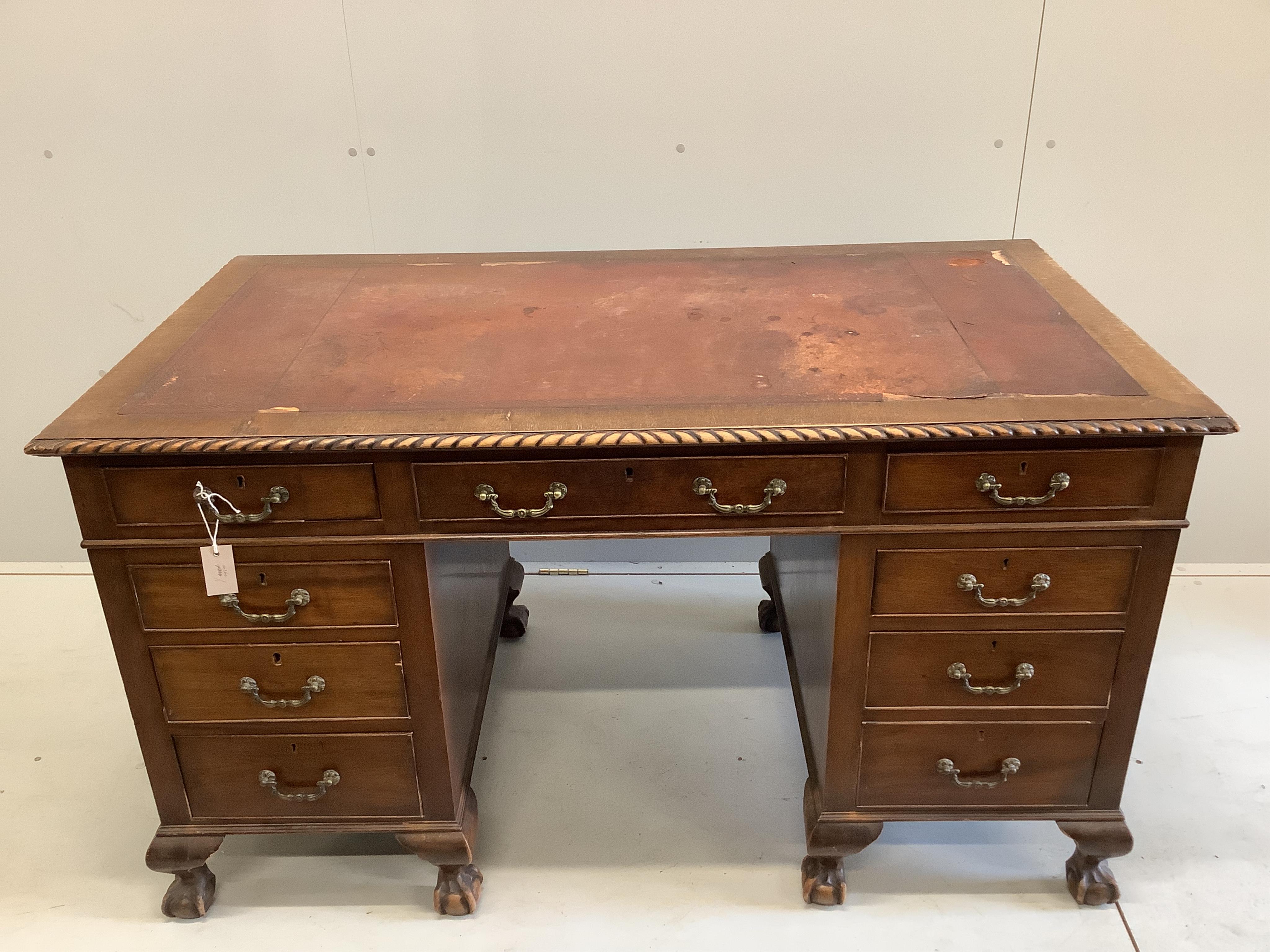 An early 20th century Chippendale Revival mahogany pedestal desk, width 138cm, depth 78cm, height 78cm. Condition - fair